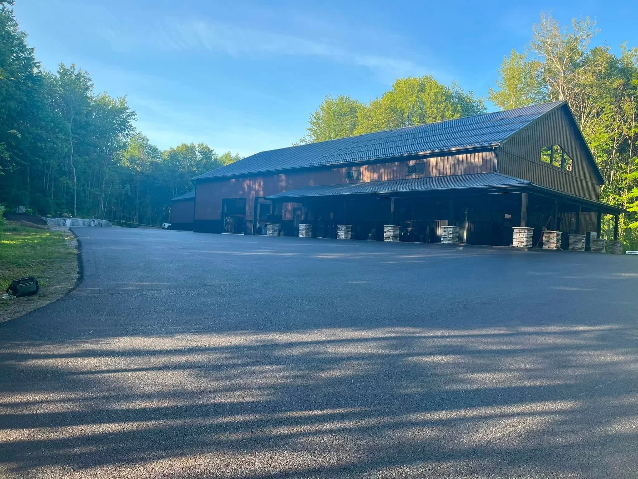 Freshly paved asphalt lot by RJ Green
