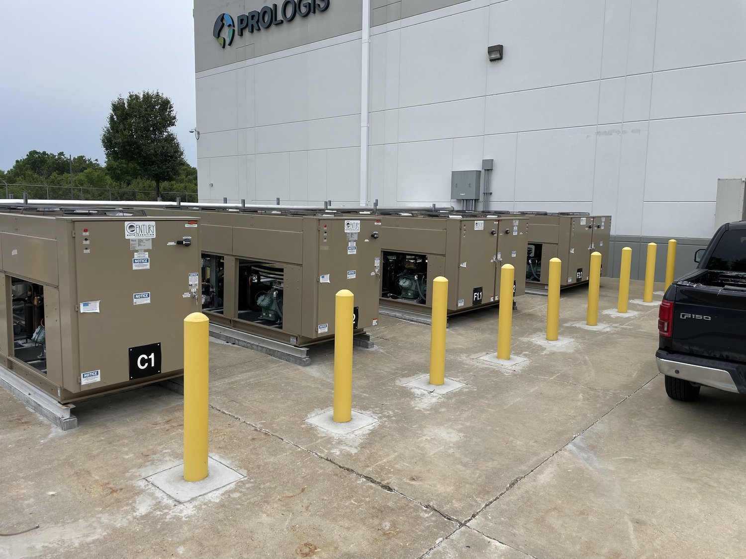A row of outdoor condensing units serving a commercial facility