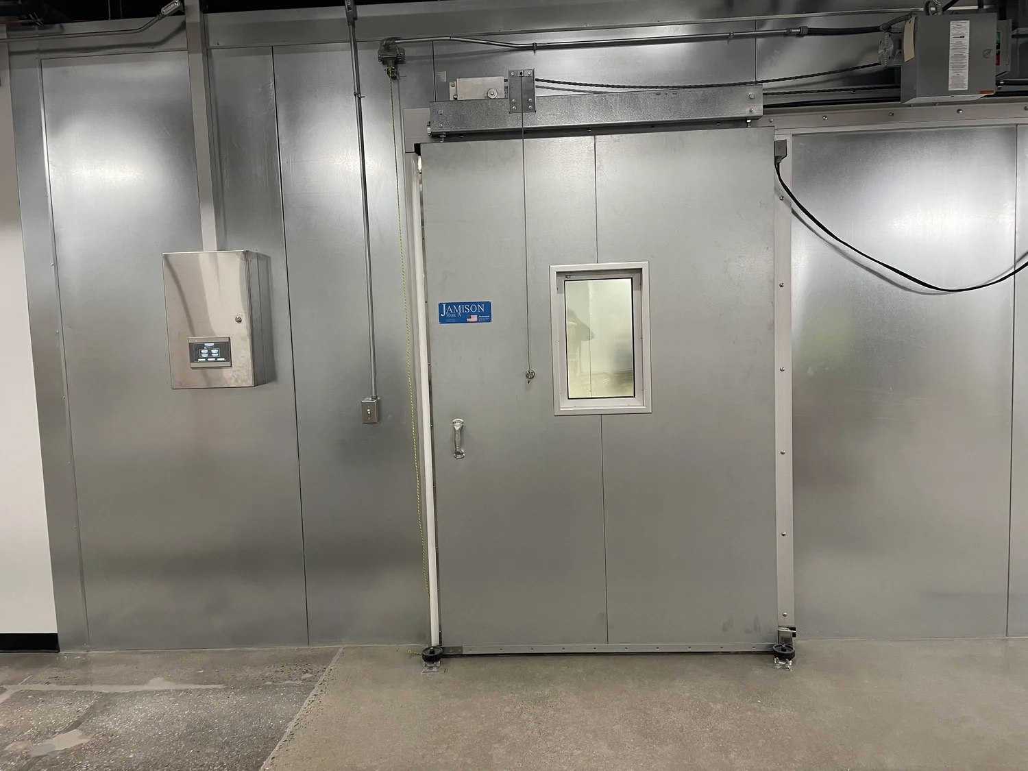 Installed insulated chamber with double doors and a viewing window