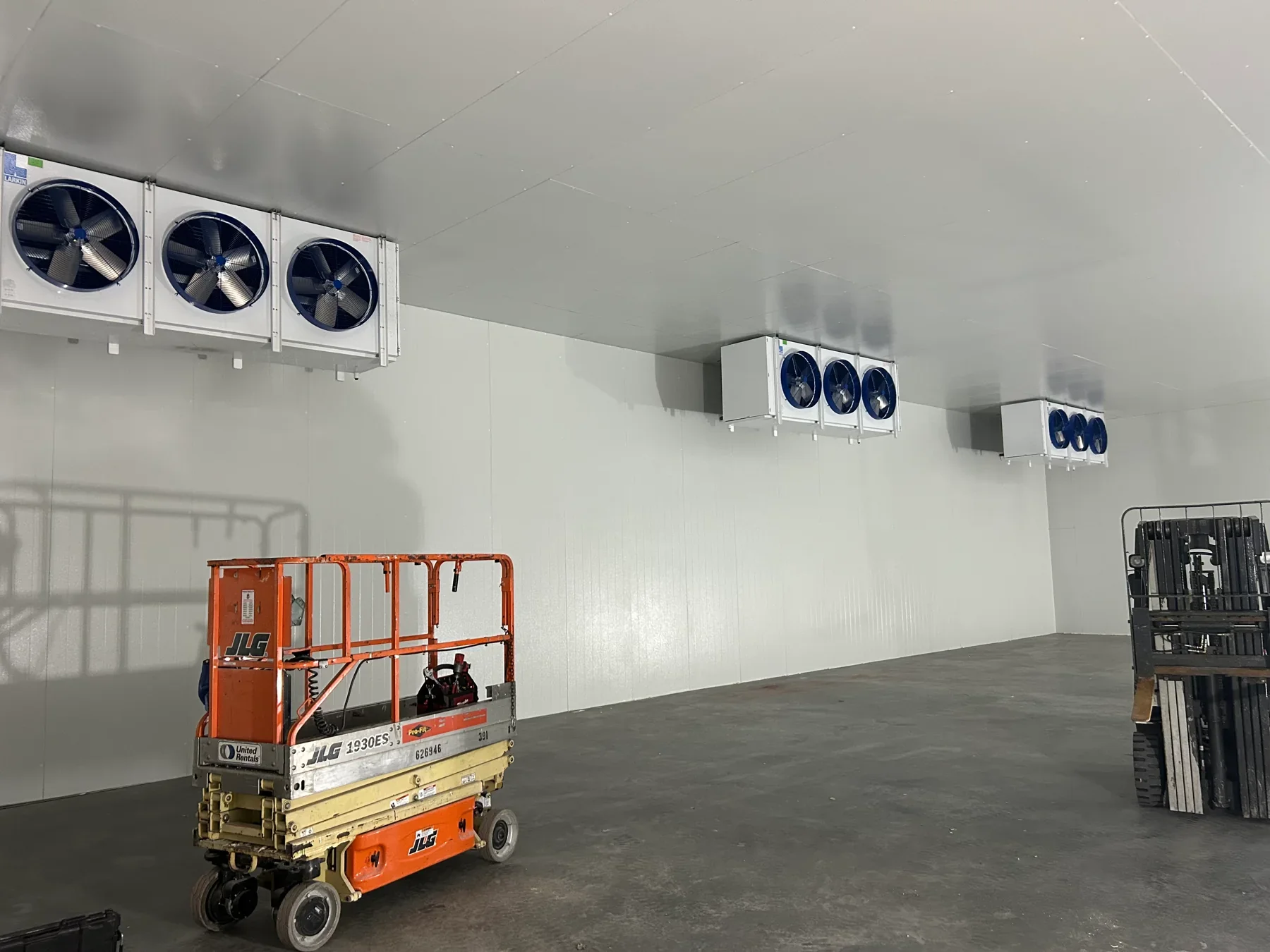 Interior of a walk-in environmental chamber with ceiling-mounted refrigeration evaporators