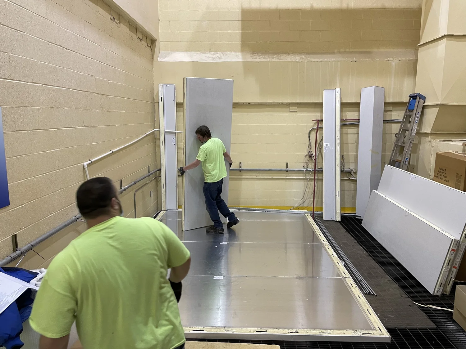 Air Flow Services crew assembling an insulated room
