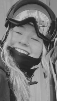 Scout in ski goggles, grinning