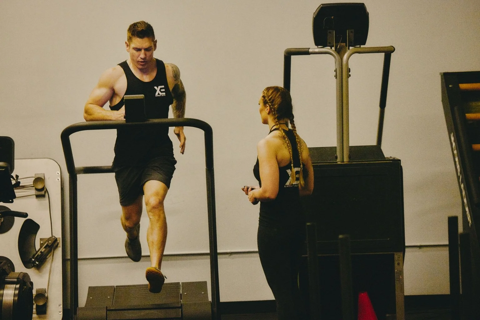 Daniel running on a treadmill with Jana beside him