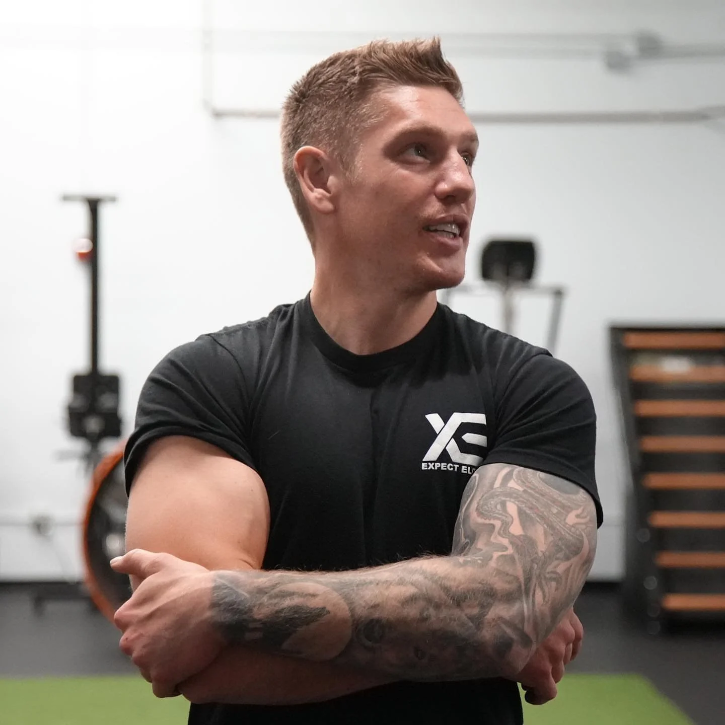 Coach Daniel in his Expect Elite shirt at the gym