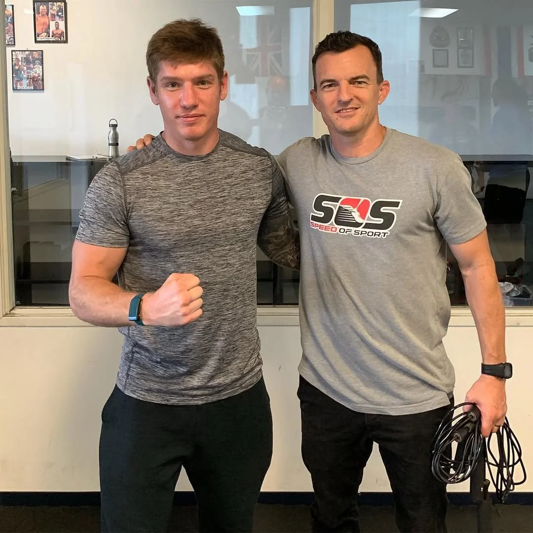 Daniel alongside a Speed of Sport trainer