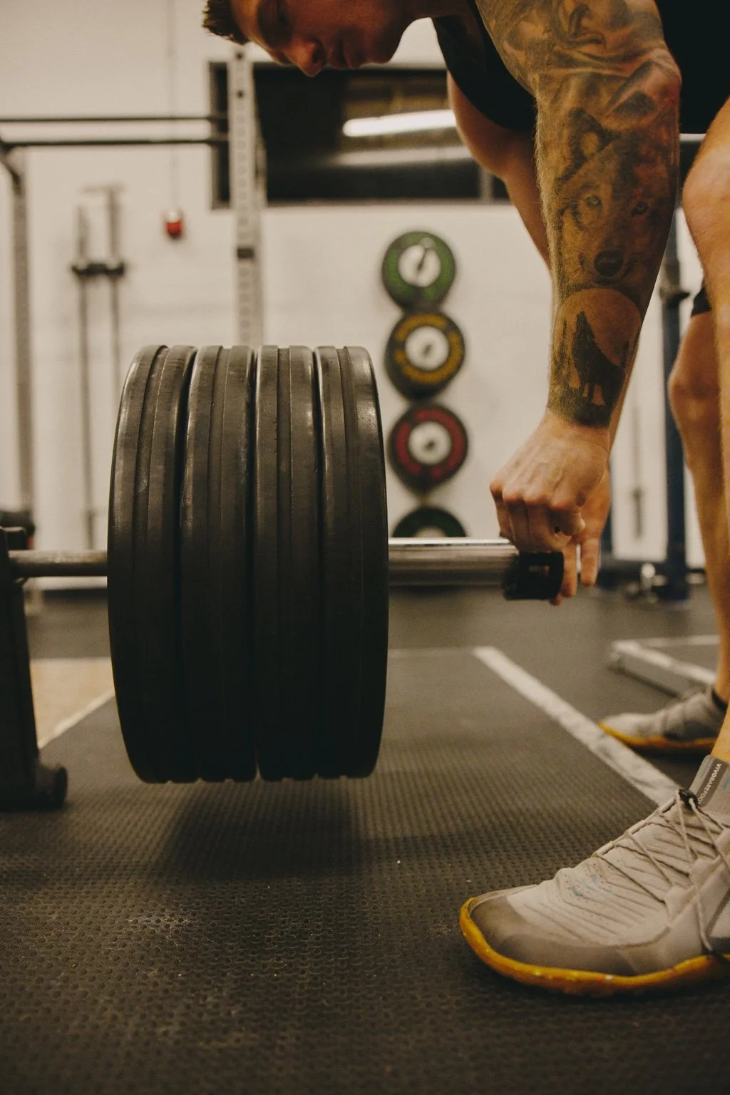 Daniel preparing a loaded barbell at Pasadena Strength and Conditioning