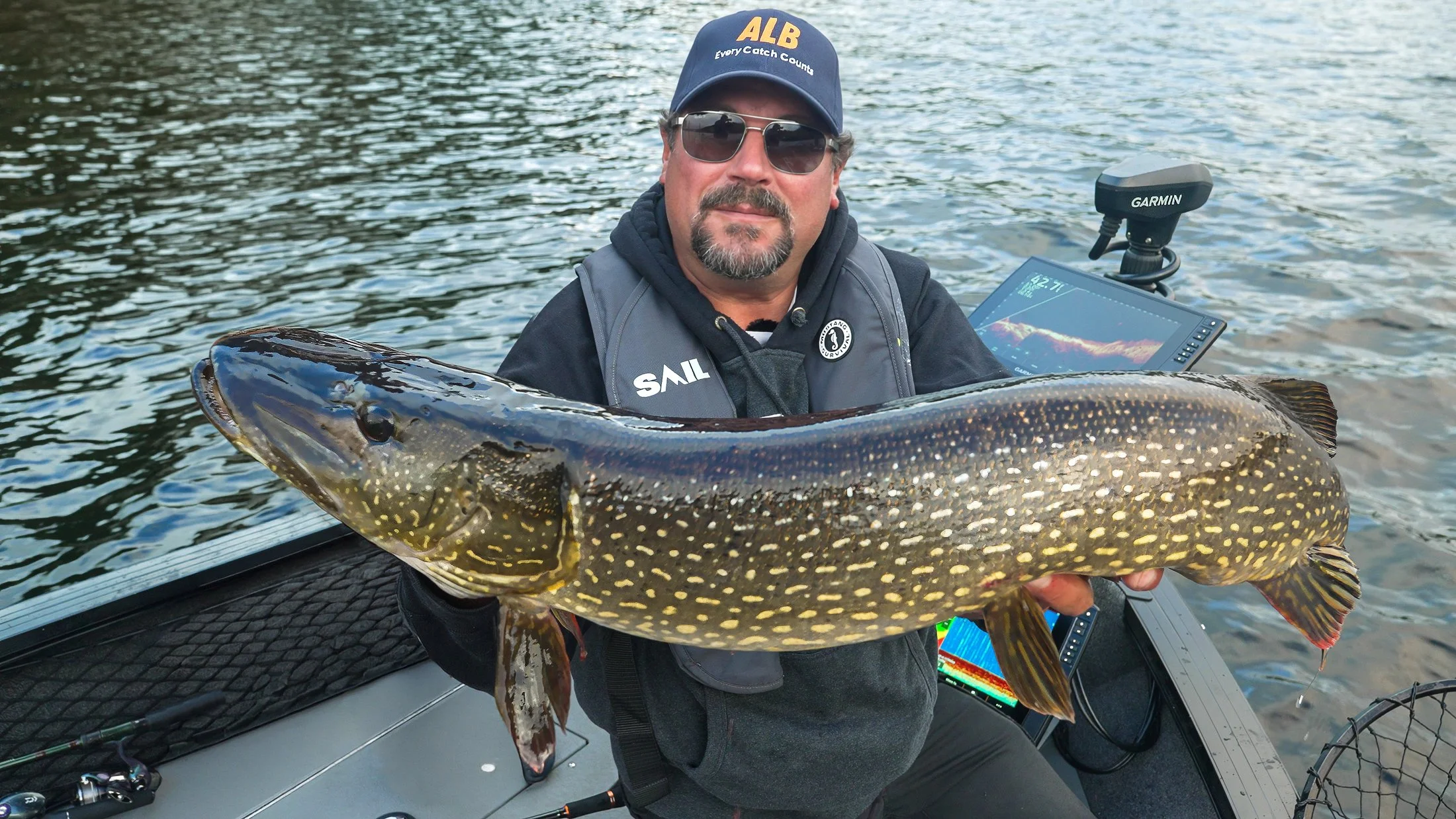 Steve Niedzwiecki holding a northern pike