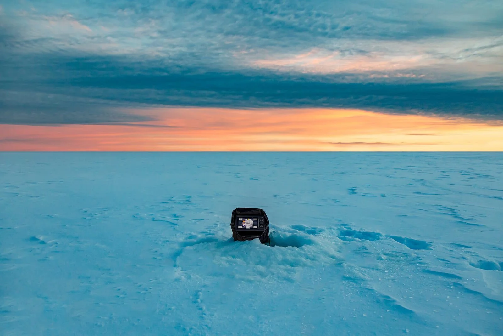 A Garmin fishfinder on a frozen lake