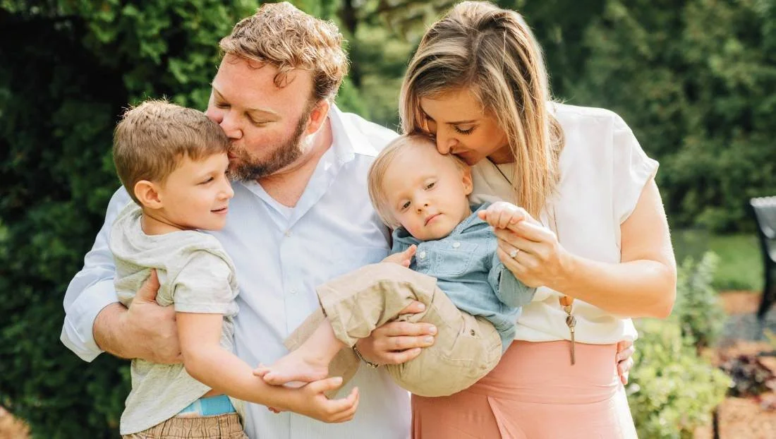 Bryan and Danielle Docobo holding their sons Liam and Ethan