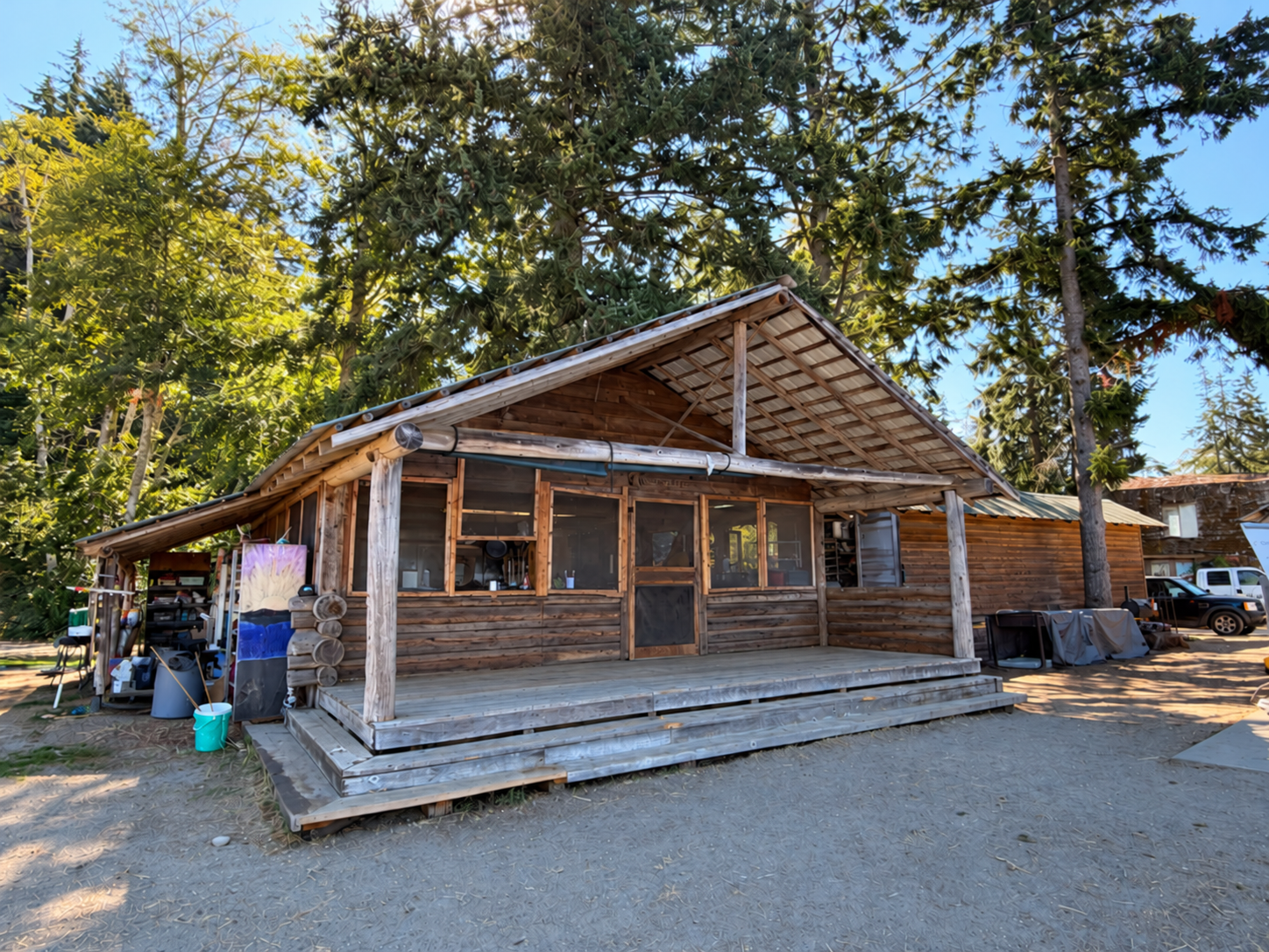 The Hurricane Ridge kitchen today, a log building with a covered porch