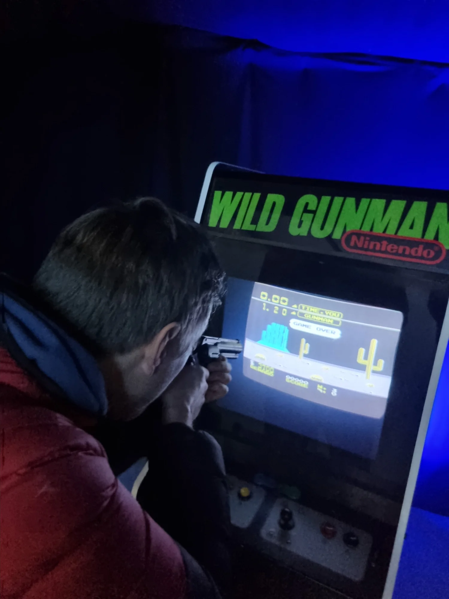 Playing the Wild Gunman arcade game – Back to the Future props exhibition, London 2022