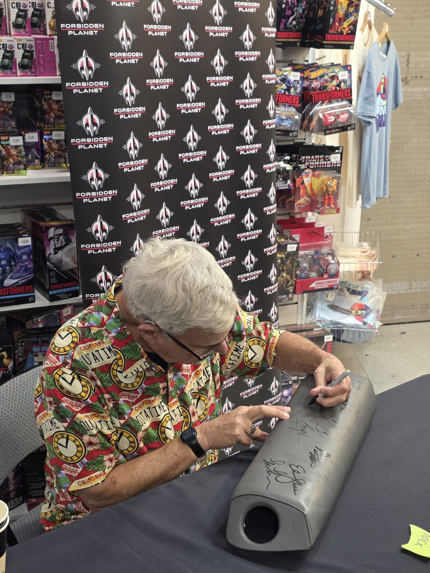 Bob Gale signing the time machine knee pad