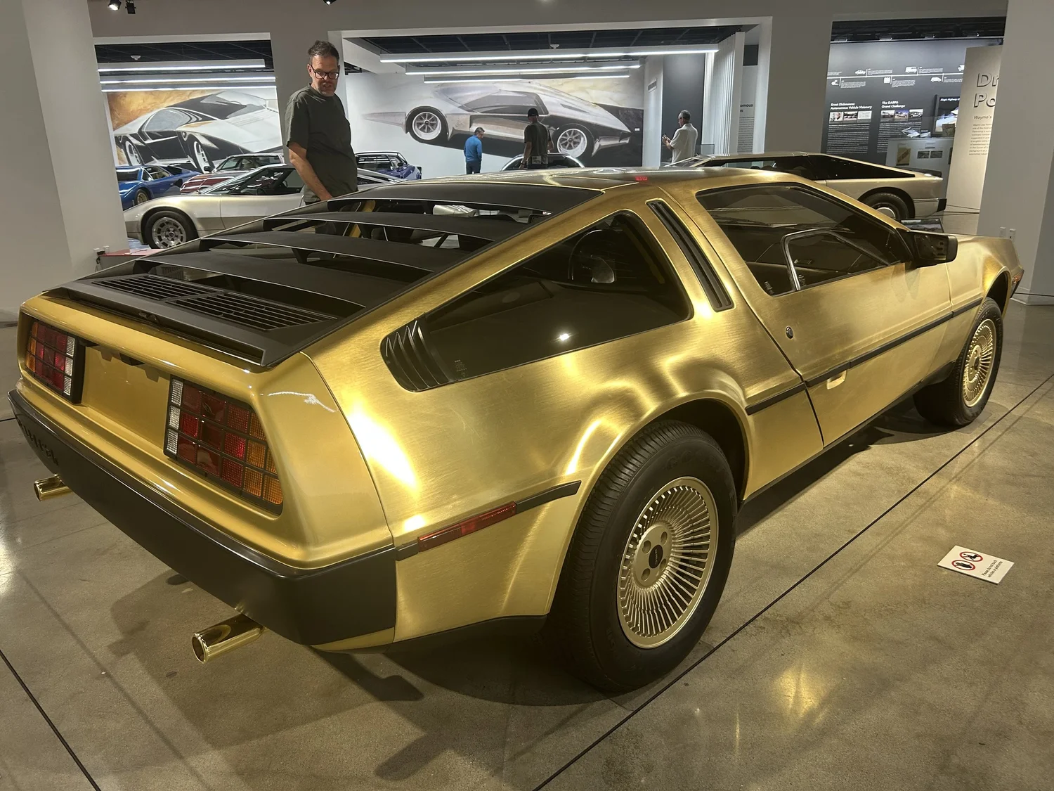 Rear view of the gold DeLorean at the Petersen Automotive Museum