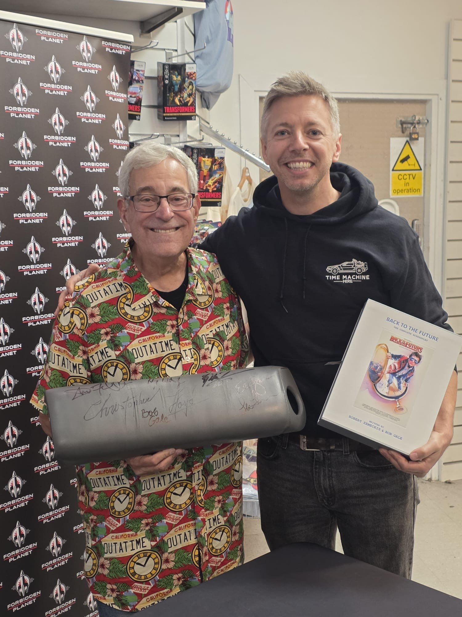 Nick with Bob Gale and the signed knee pad at Forbidden Planet London