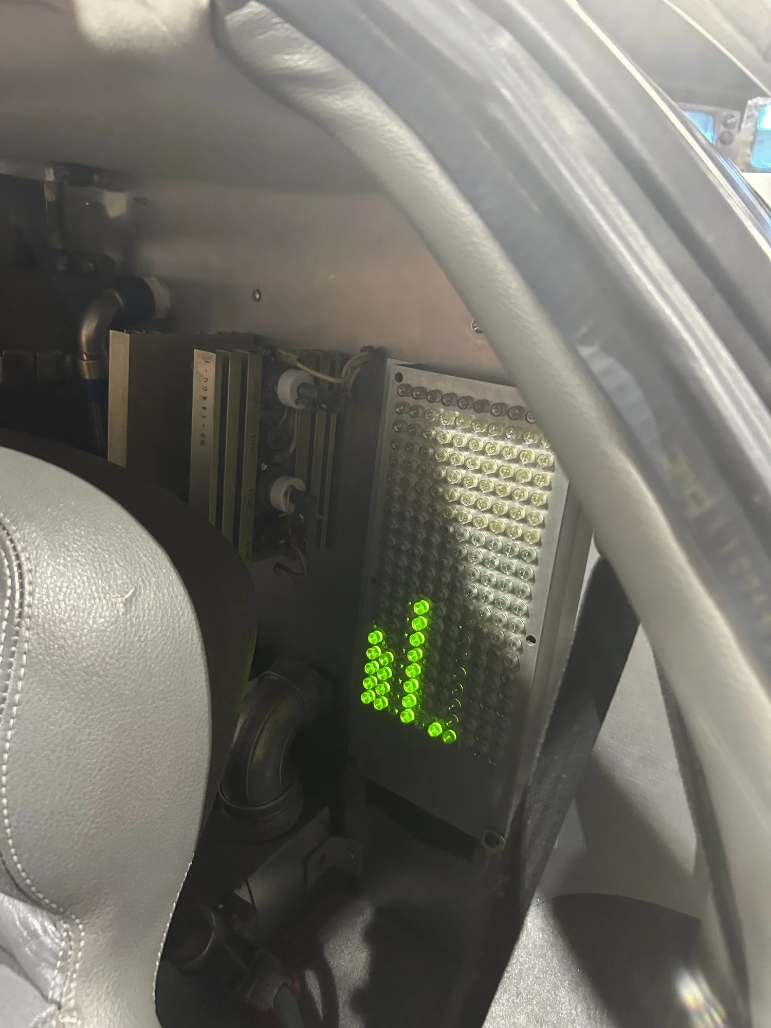 Green bar-graph display inside the A car