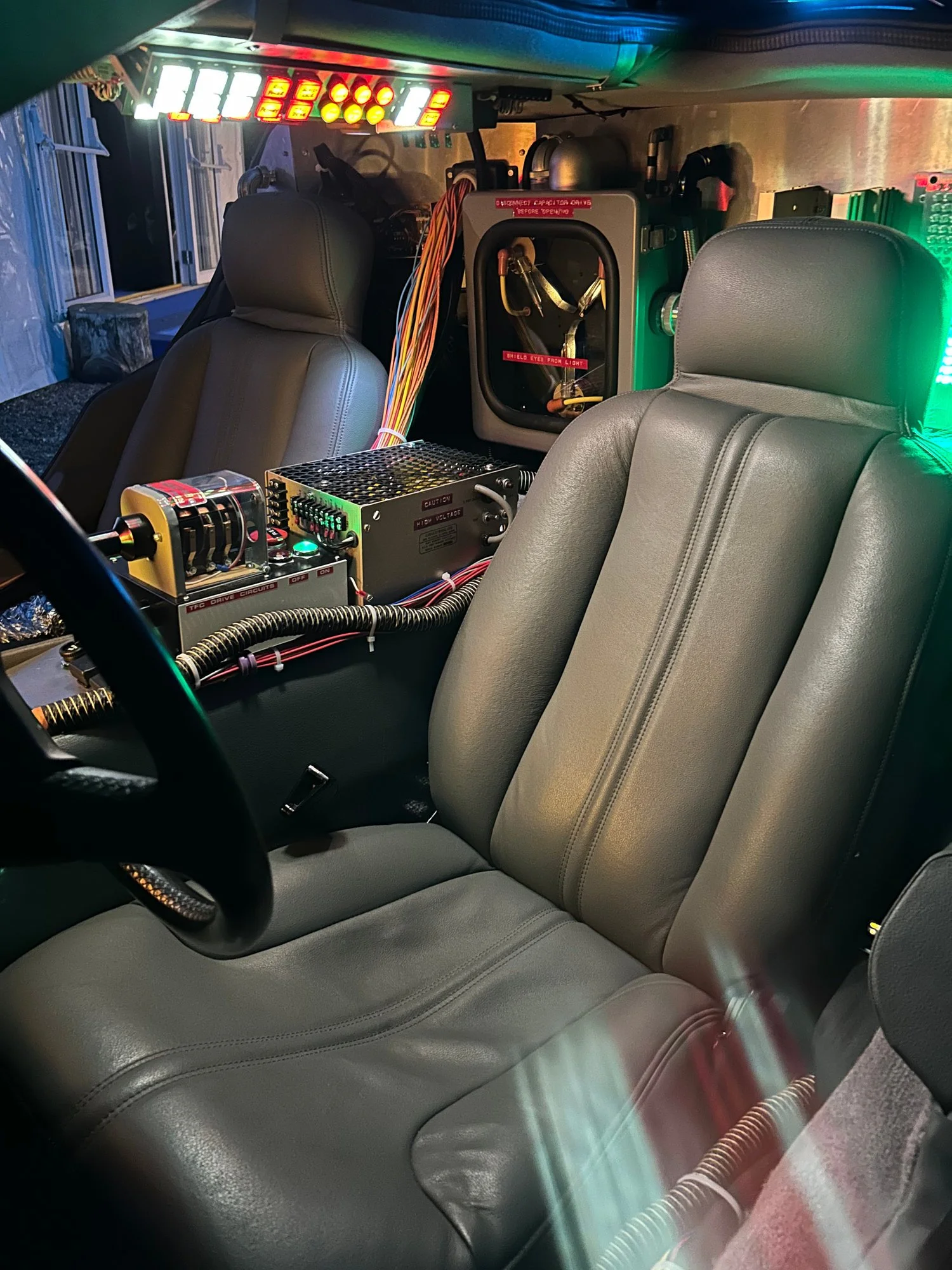 The time machine interior with grey seats and switches