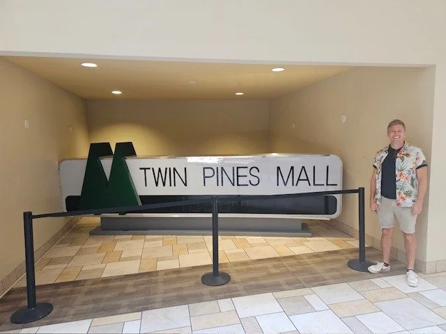 Nick with the Twin Pines Mall sign