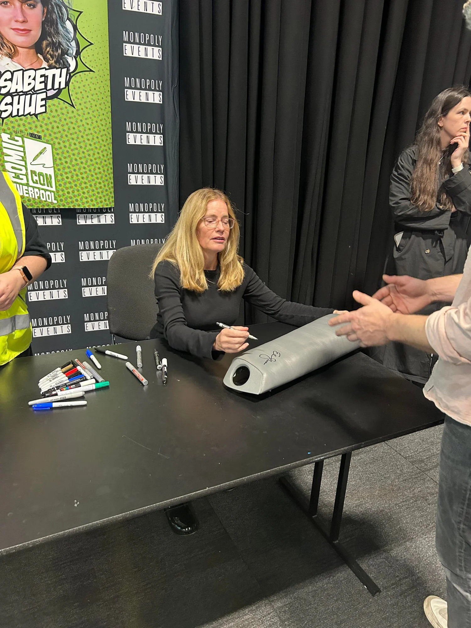 Elizabeth Shue signing the time machine knee pad