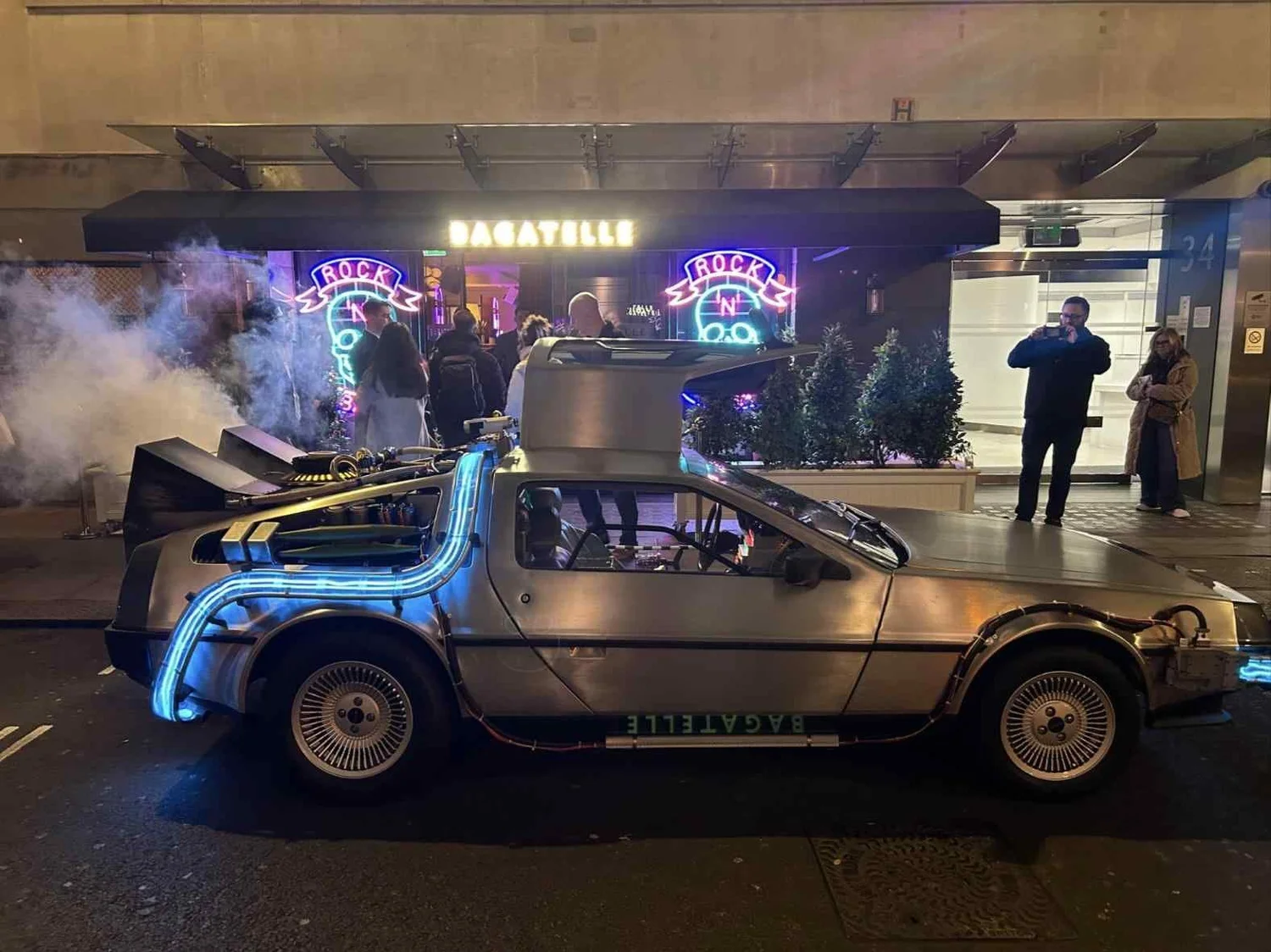 Time machine outside a London restaurant at night