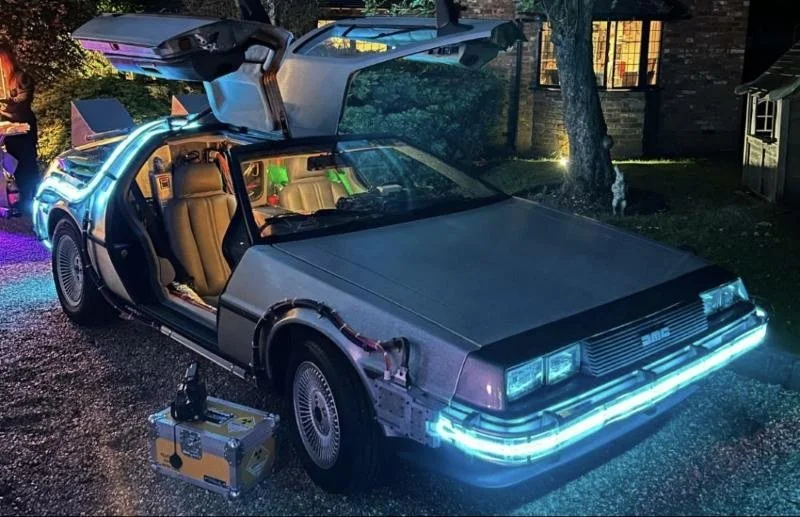 The yellow plutonium case beside the time machine at night