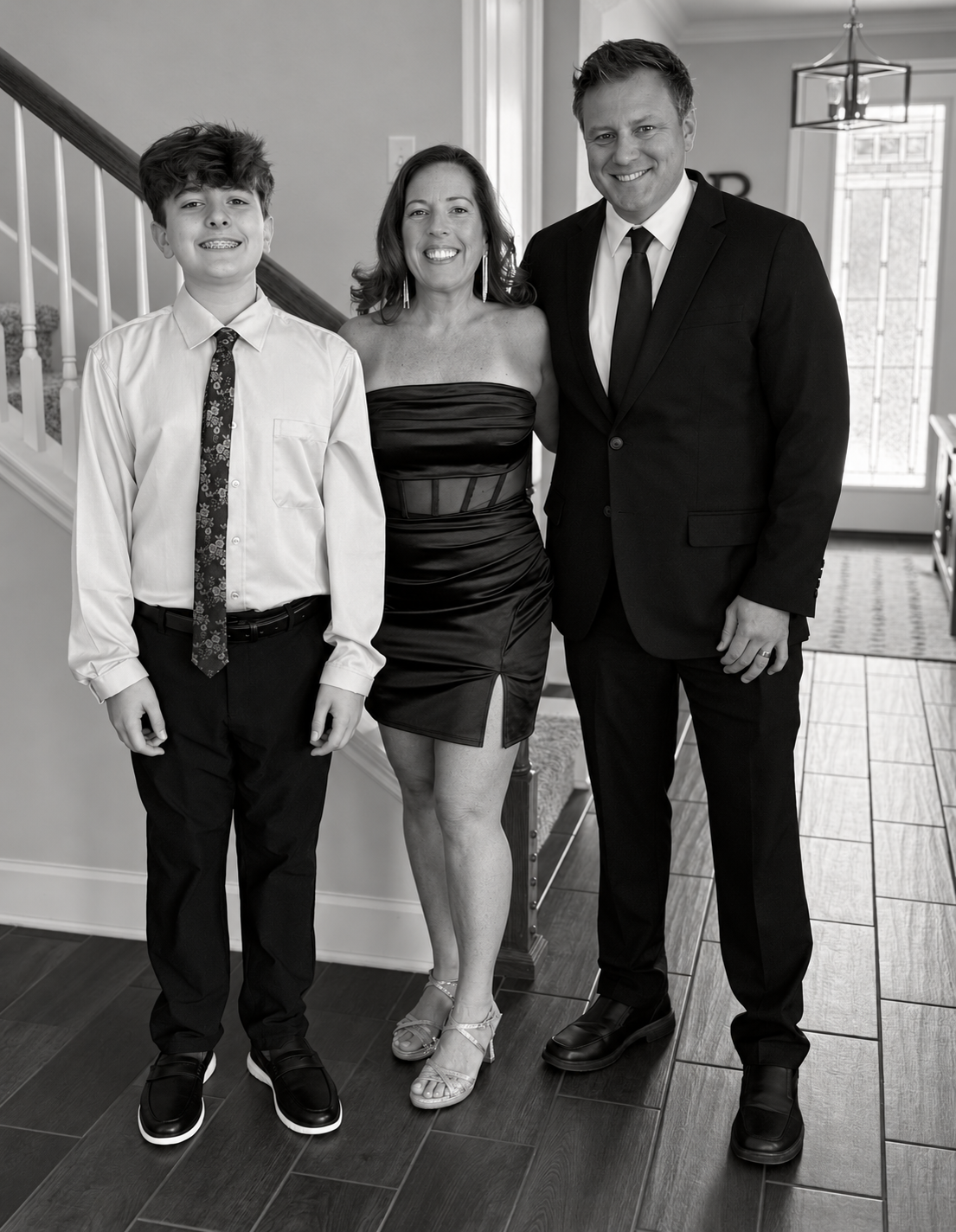 Steph with her husband Brett and son Evan at home
