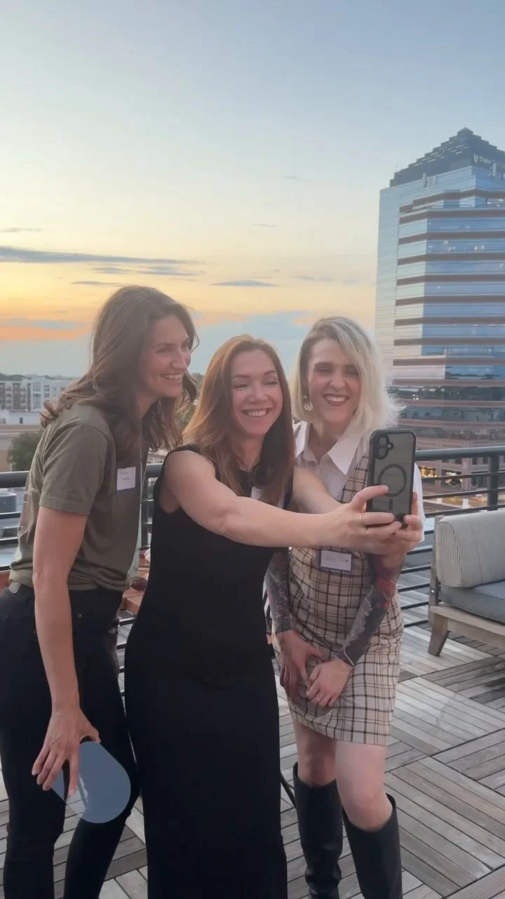Three women taking a selfie together at The Women's Social