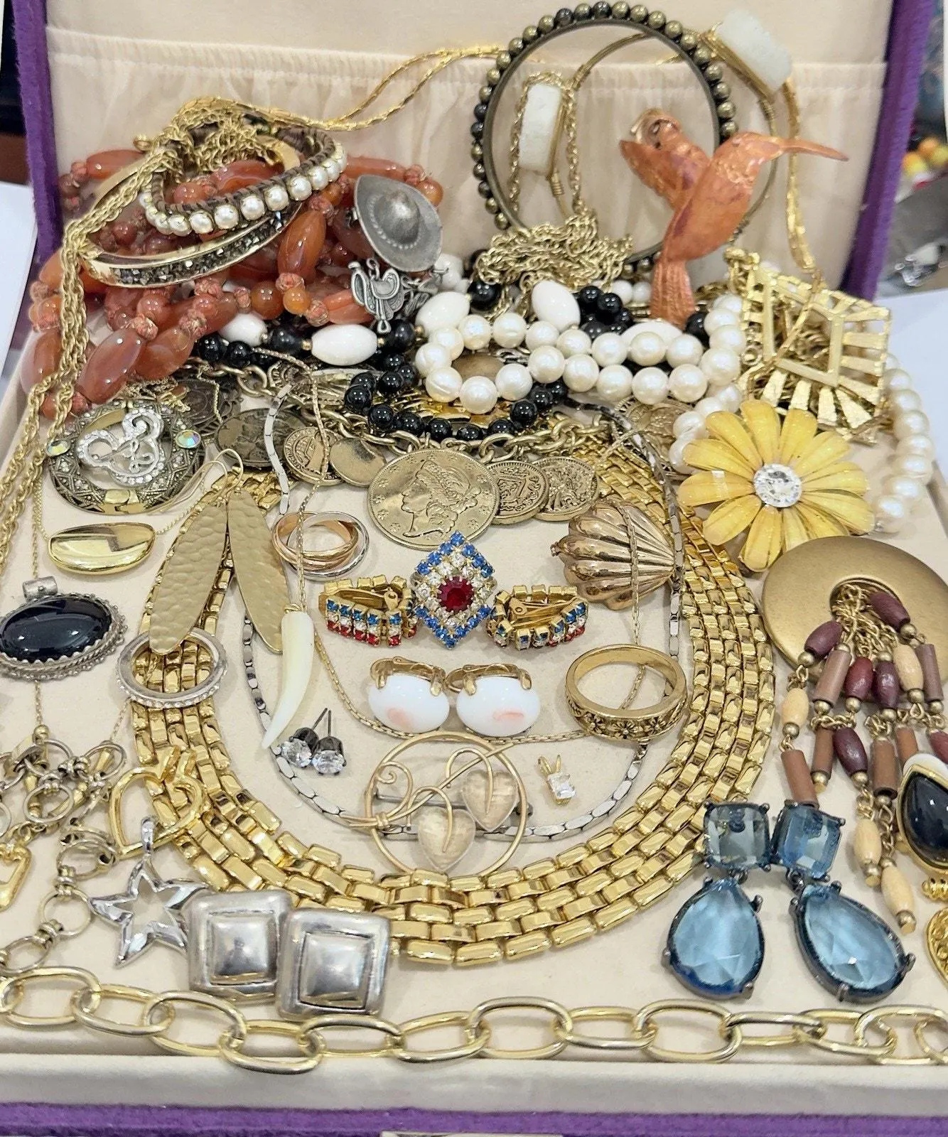 Estate jewelry collection with necklaces, bracelets, brooches and earrings