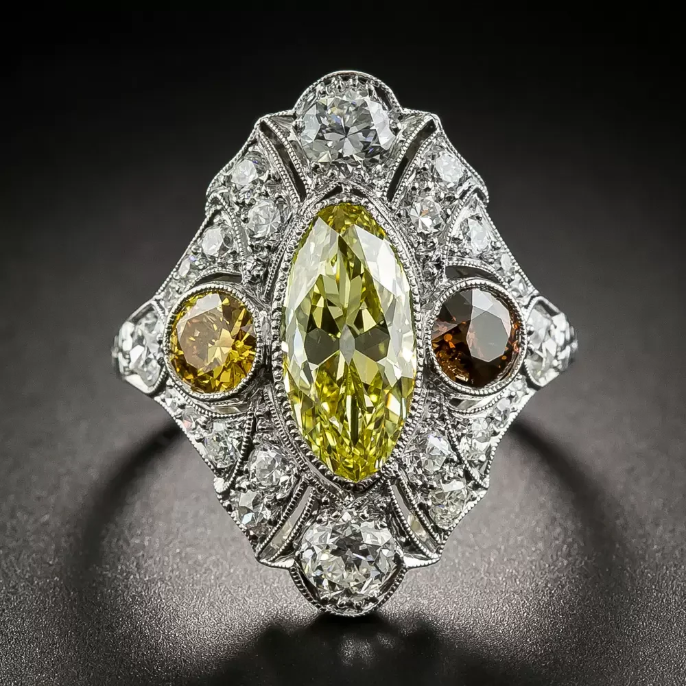 Art Deco-style ring with an elongated yellow center diamond and white and colored accent diamonds