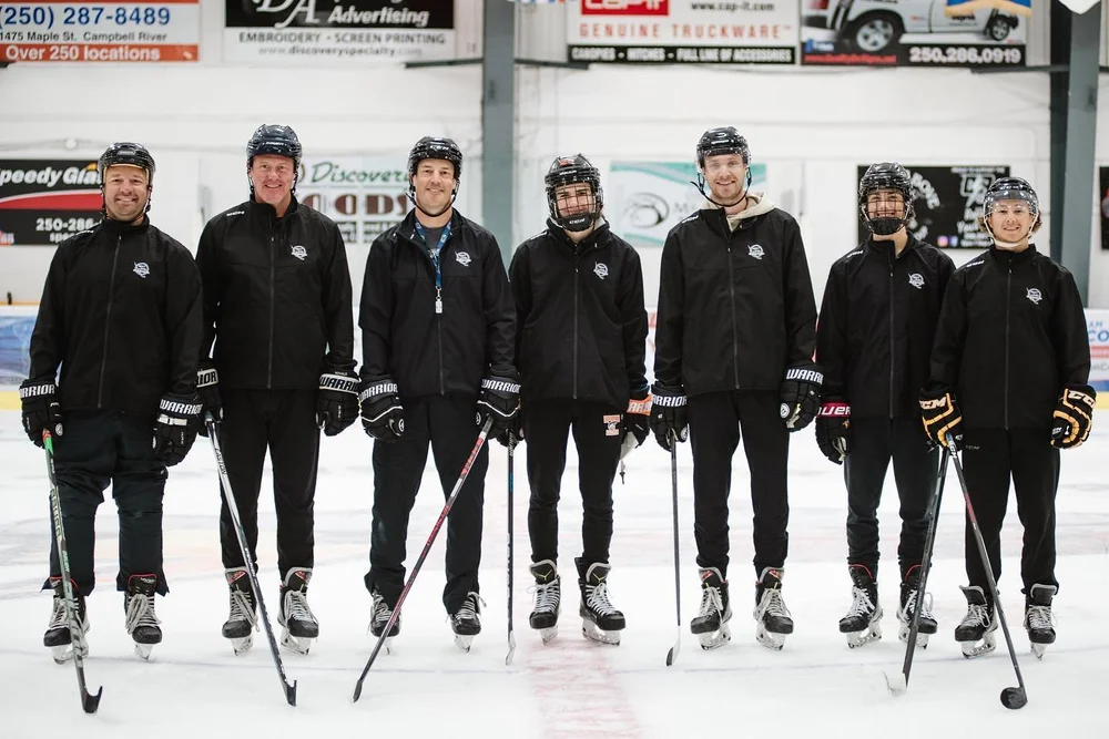 Next Level Training coaching staff on the ice