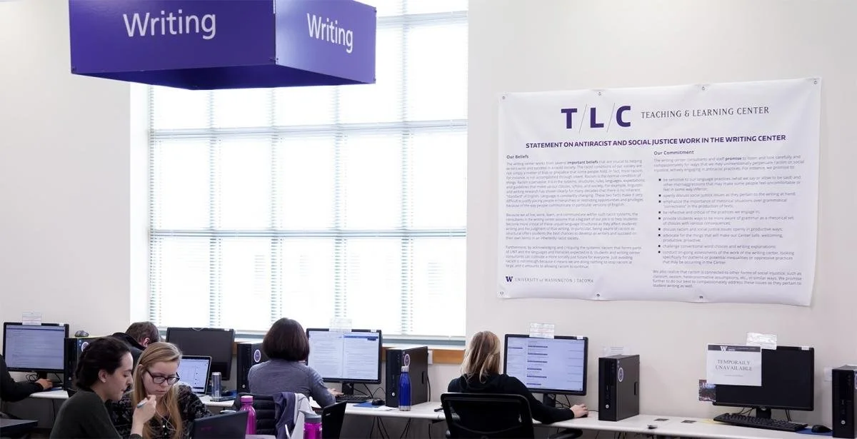 UW Tacoma Writing Center with anti-racism statement wall banner.