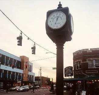 Clock and street scene in Tacoma’s Hilltop neighborhood