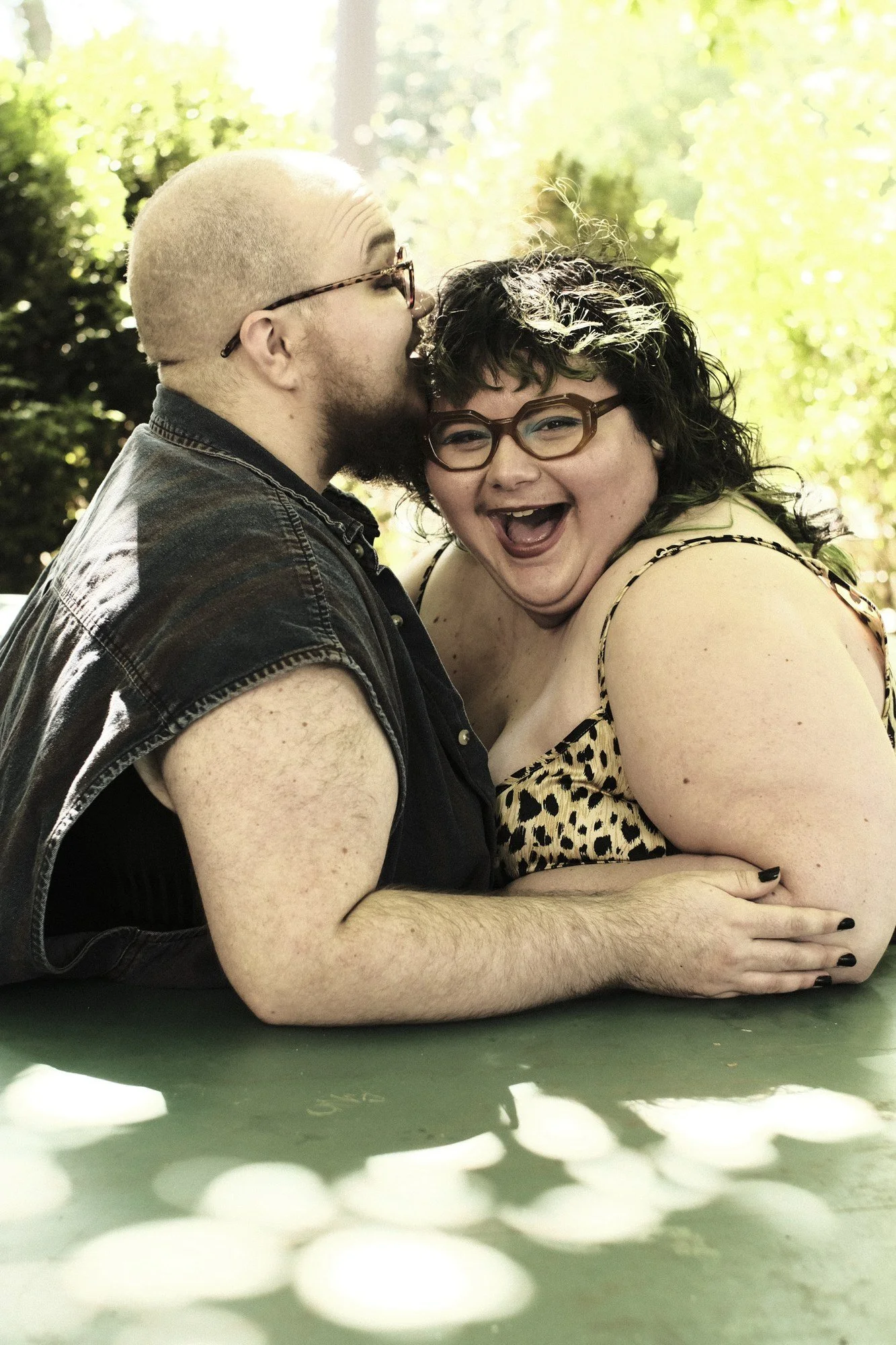 A kiss on the head sends their partner into a laugh.