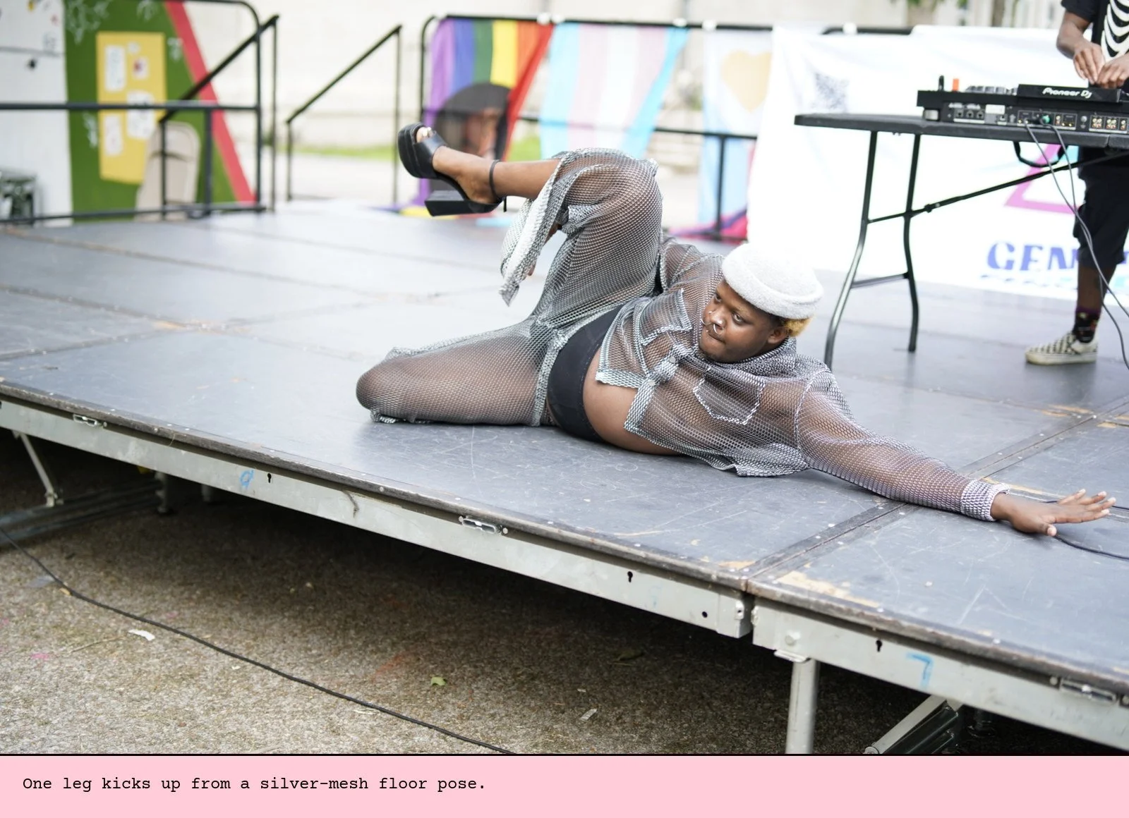 One leg kicks up from a silver-mesh floor pose.