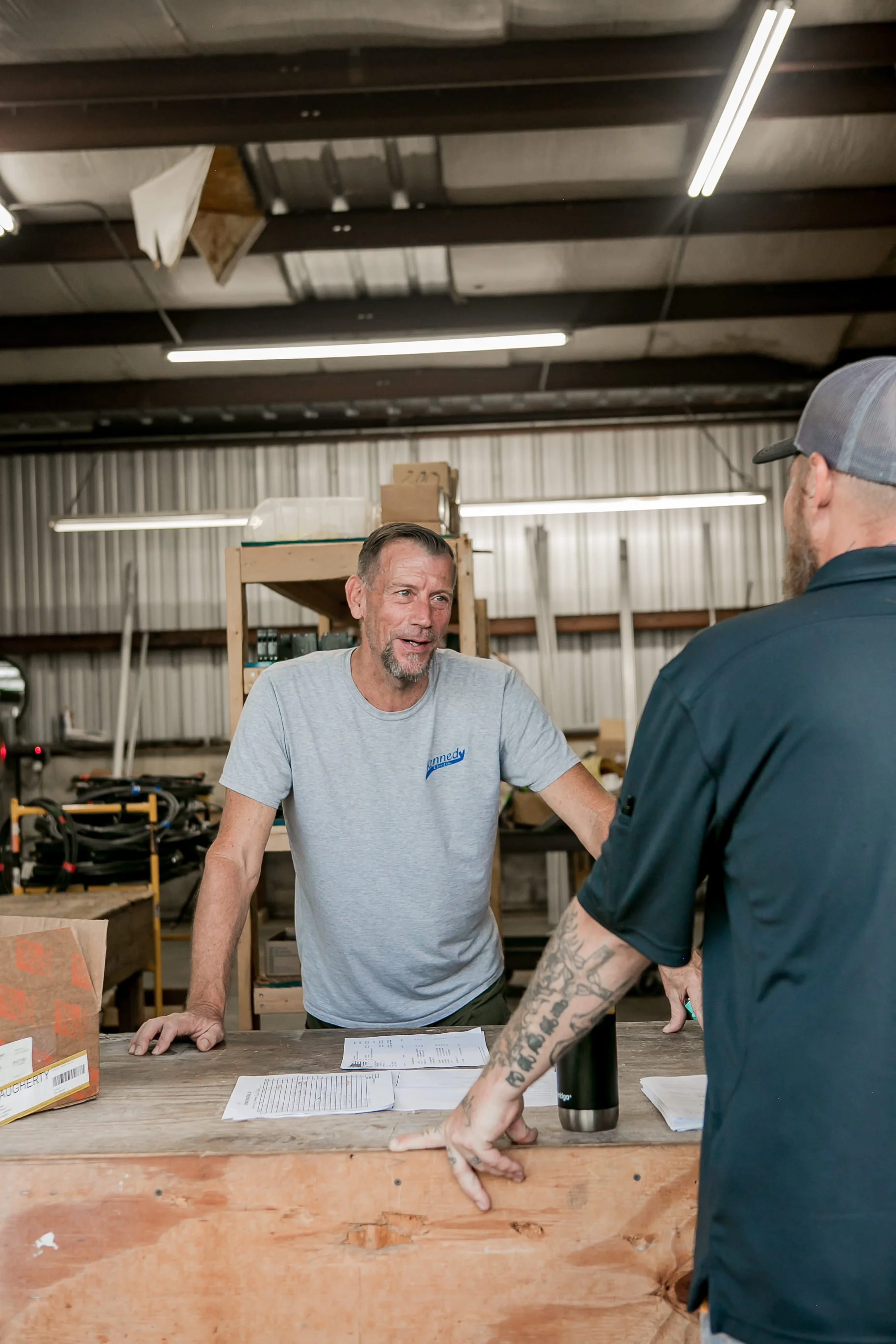 Two men at a shop workbench