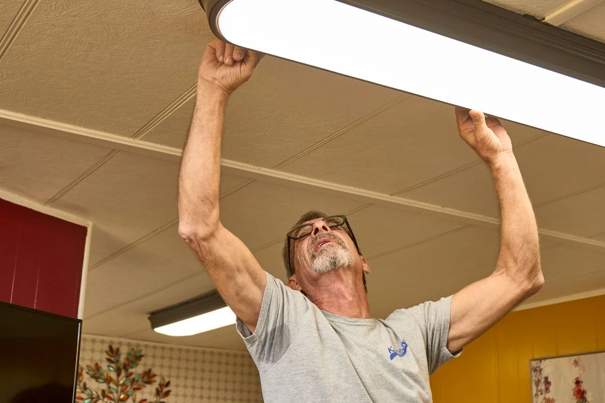 Kennedy Electric electrician troubleshooting a commercial electrical panel in Brooksville, FL.