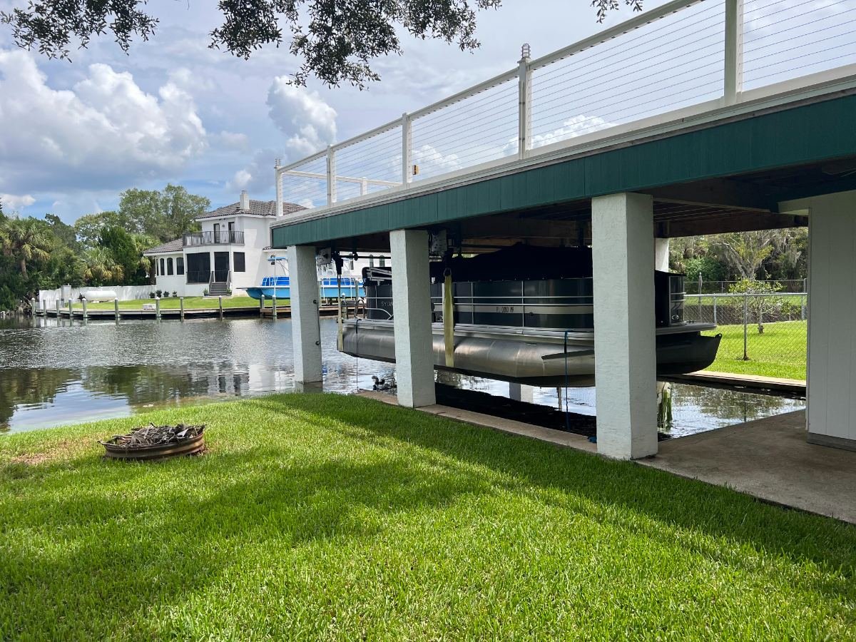 Boat lift and dock wiring on a lake dock at low water, by Kennedy Electric.