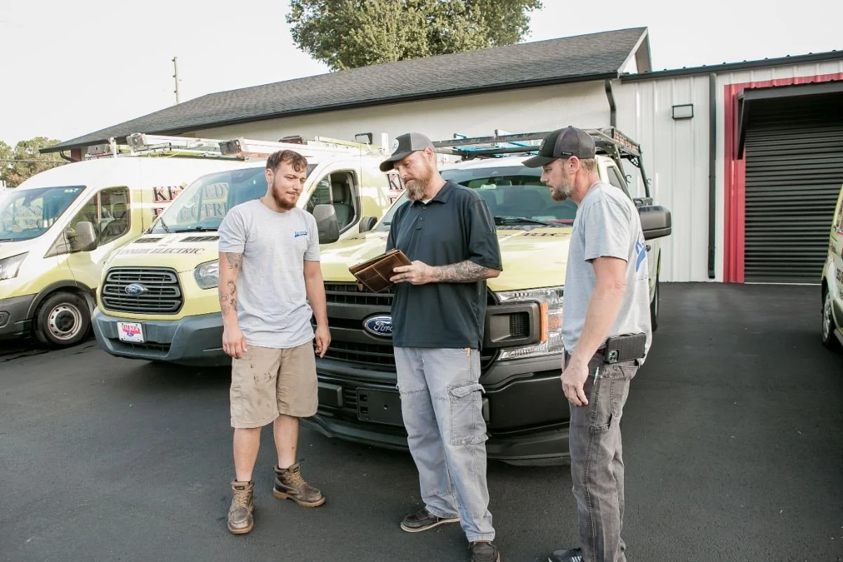Kennedy Electric team reviewing a job