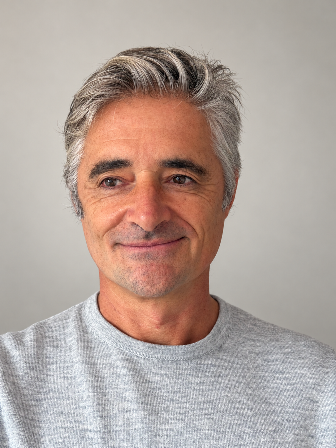 Enzo Bicchieri in a grey sweater