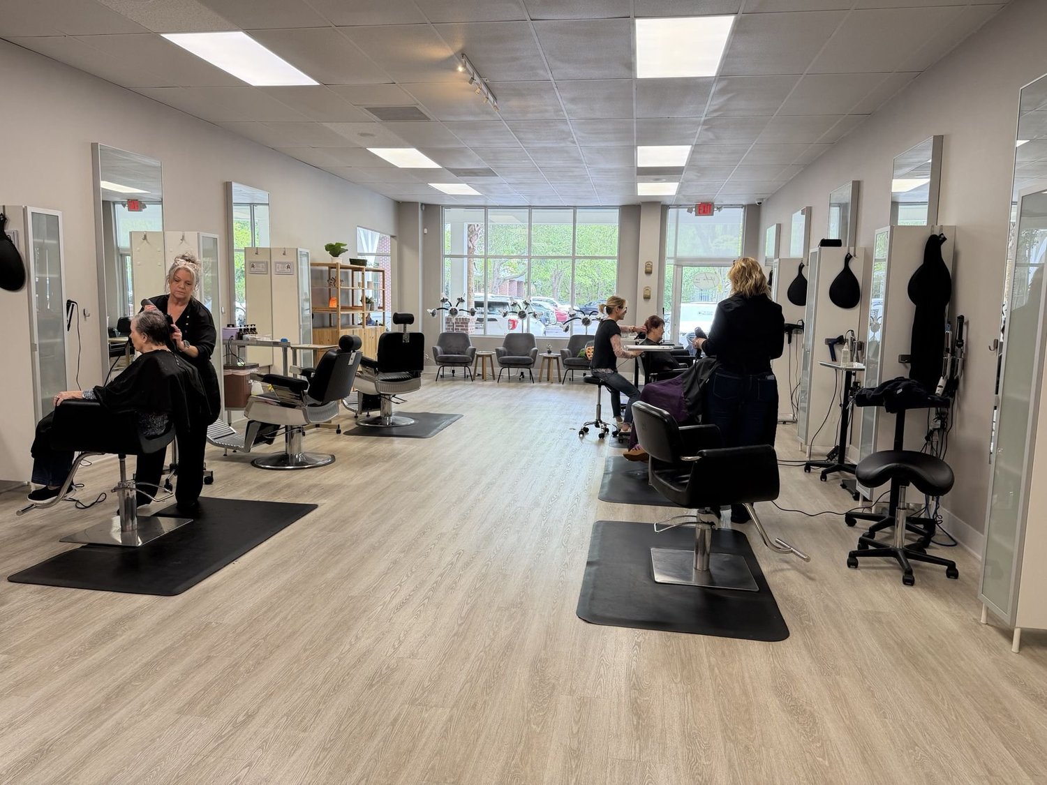 Stylists working on the salon floor at Studio XO Salon