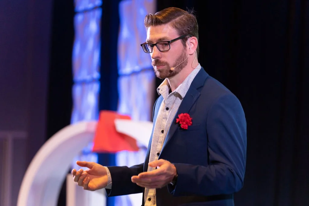 Patrick Linfante speaking on stage