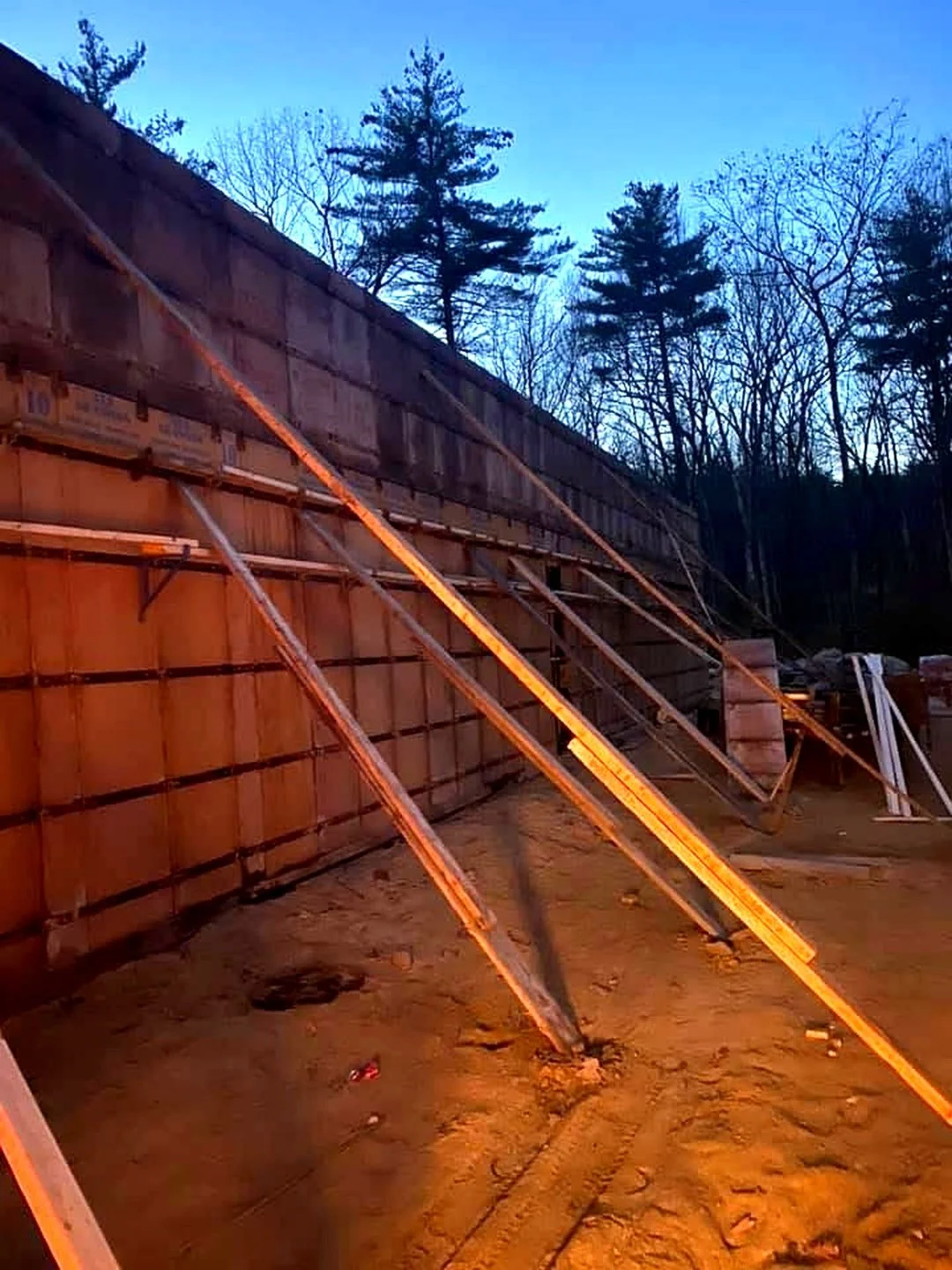 Tall braced wall forms at a construction site