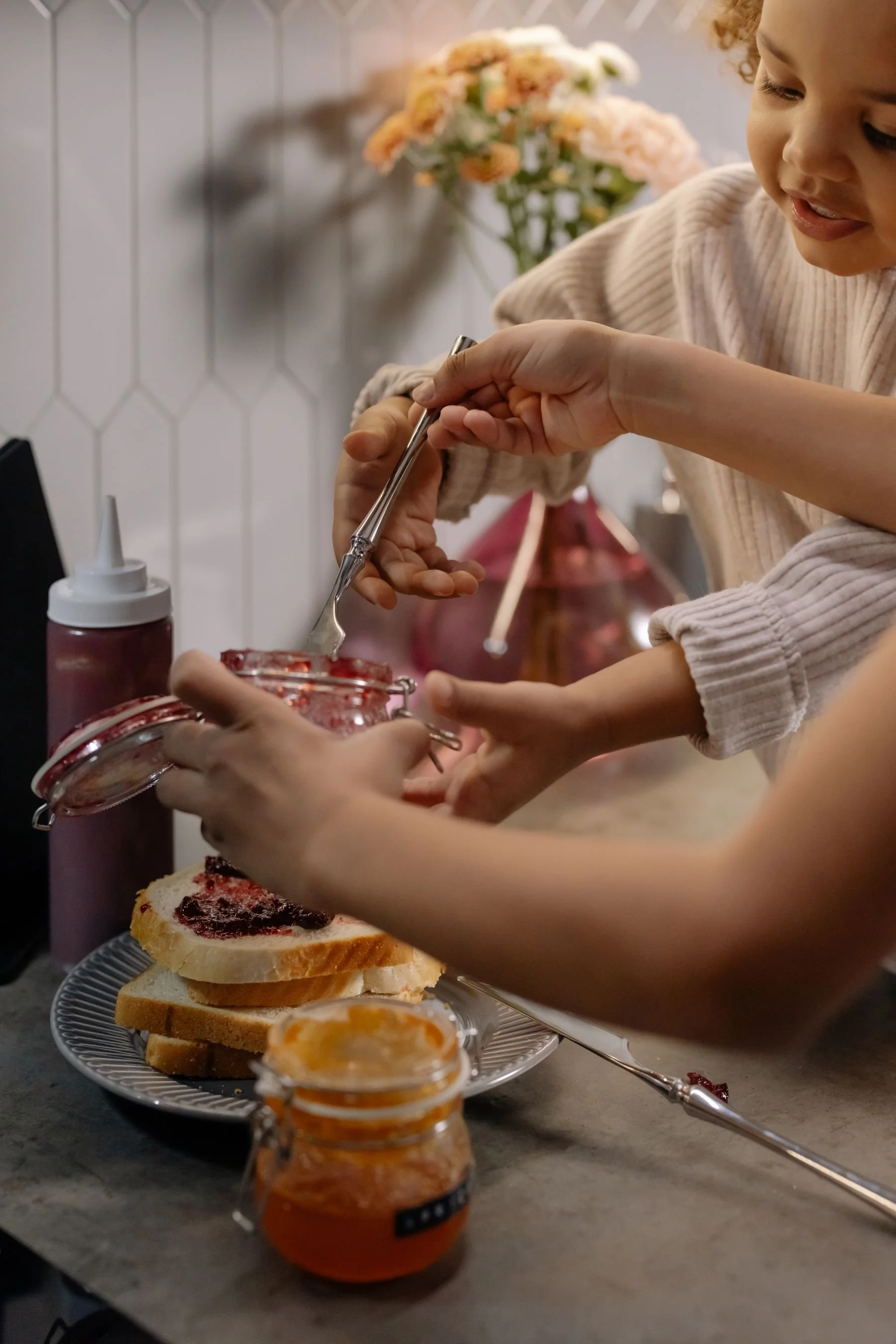 Child making a sandwich in the kitchen