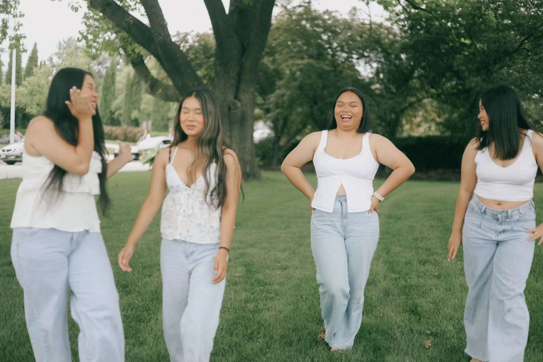 Friends laughing together in a park