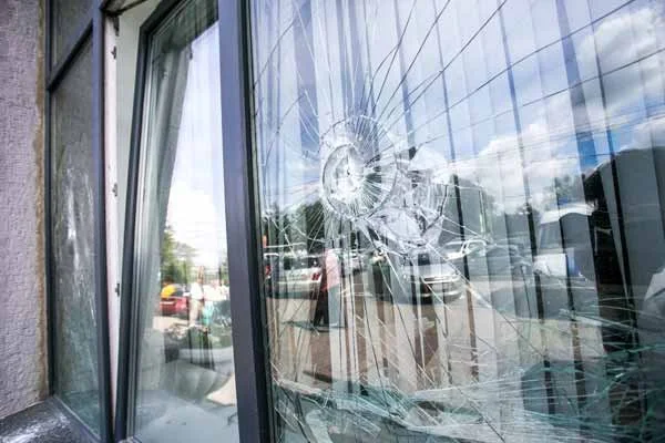 Damaged commercial storefront glass awaiting replacement