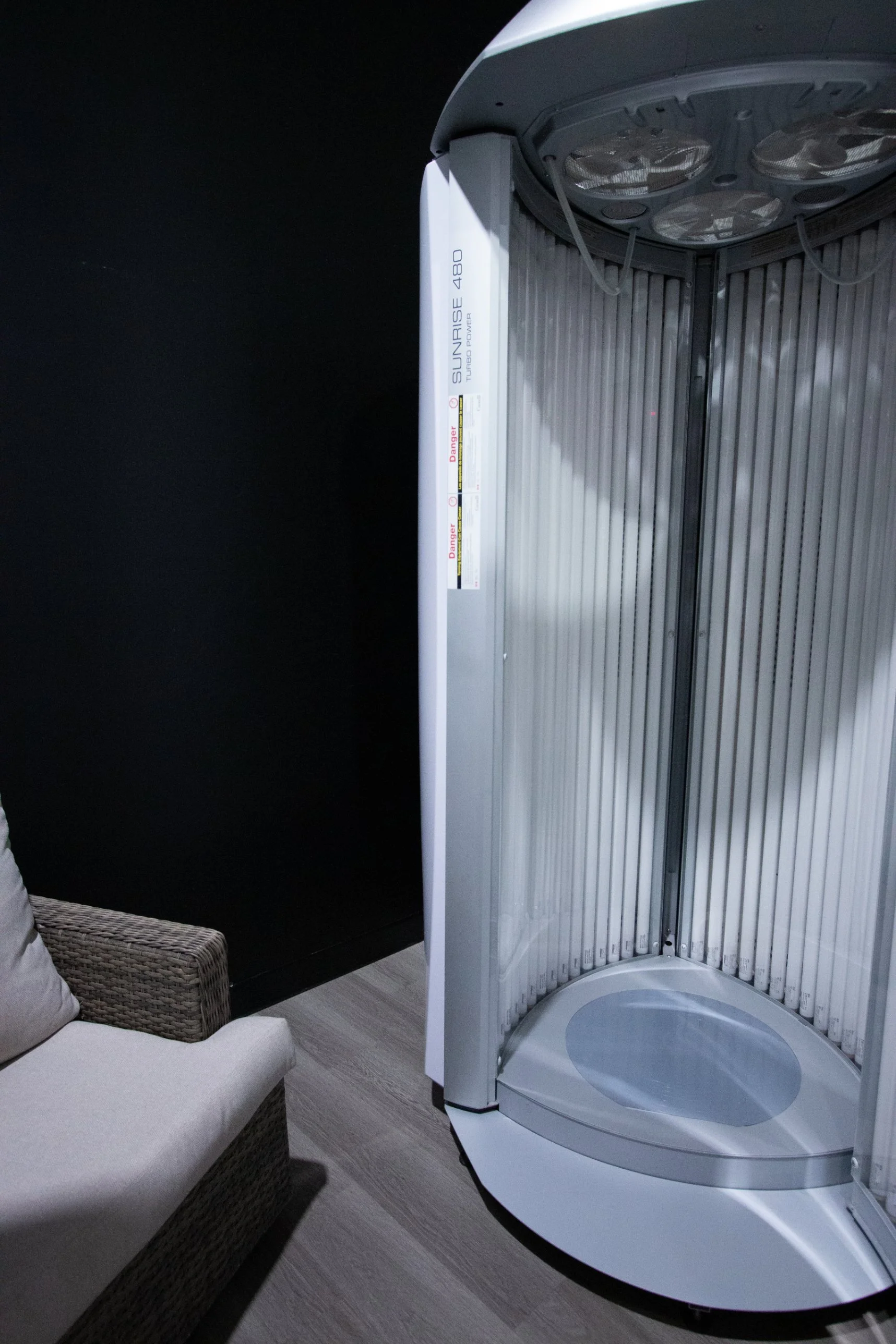 The tanning suite at HDF with a lounge chair beside the booth