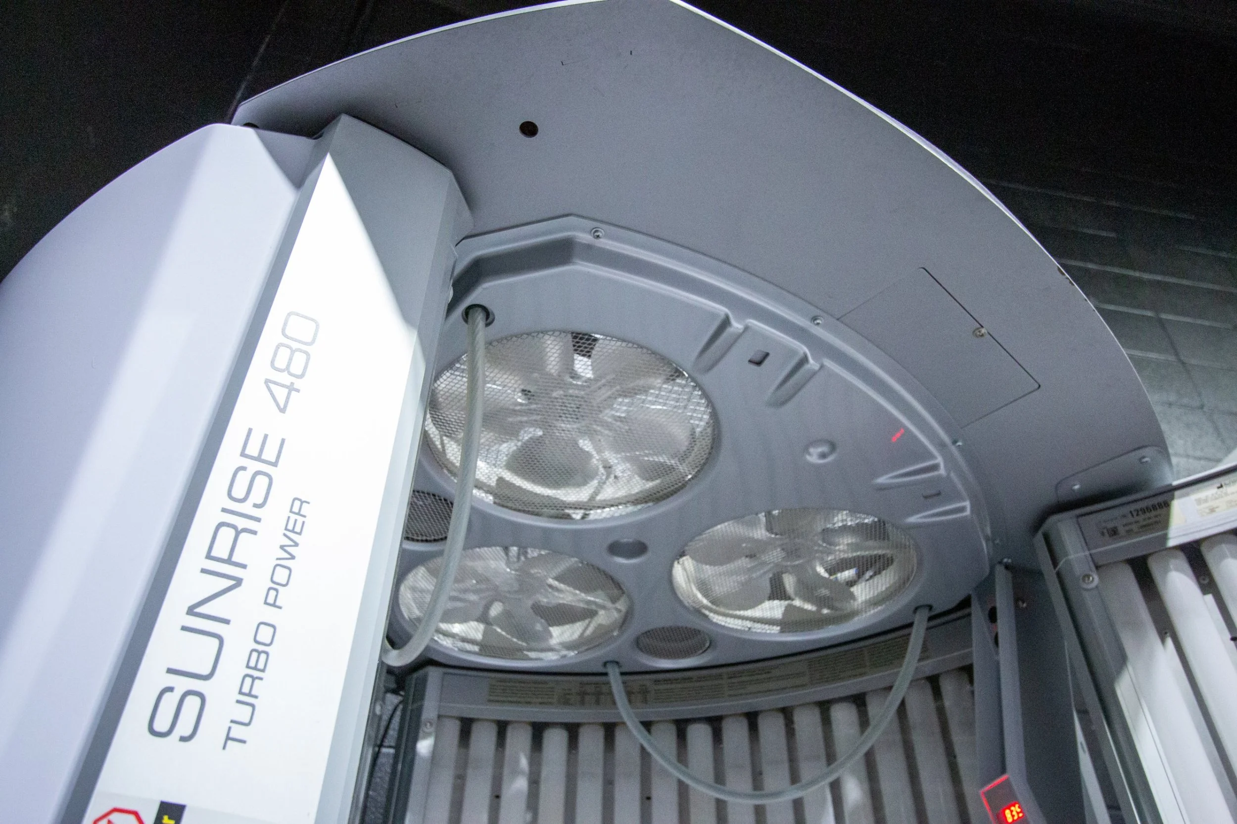 Close-up of the booth's body cooling fans and Sunrise 480 Turbo Power branding