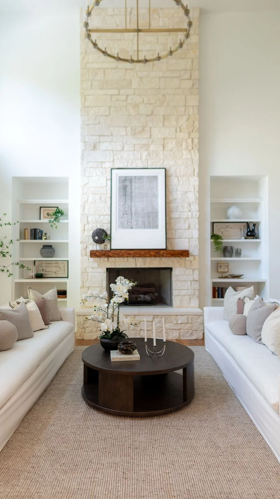 Bright living room with stone fireplace in a Moore County home