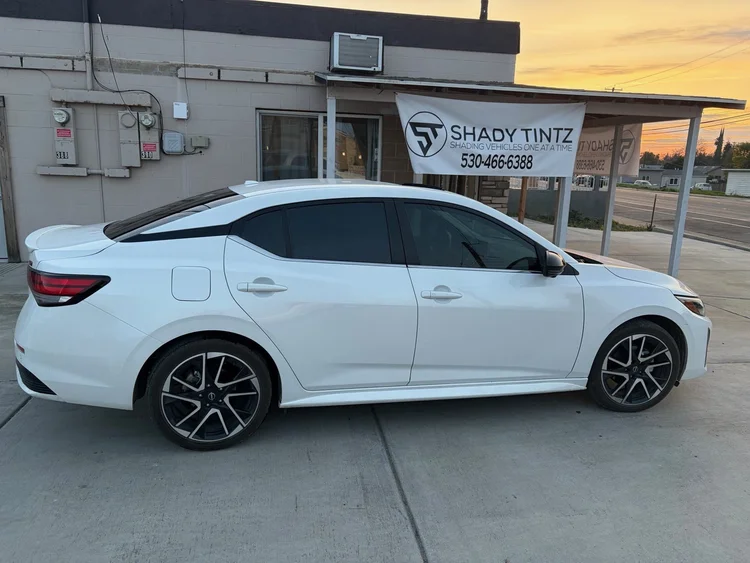 White Nissan Sentra with ceramic window tint at sunset, Shady Tintz, Yuba City