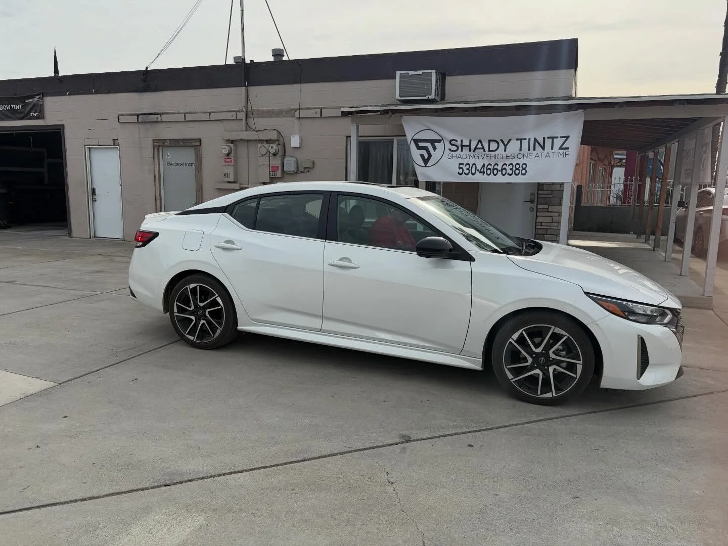 White Nissan Sentra front three-quarter view with window tint, Shady Tintz, Yuba City