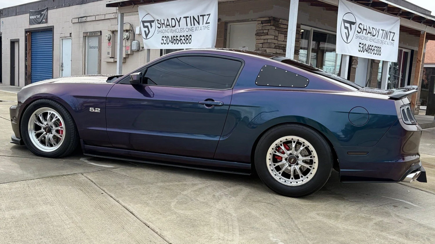 Color-shift Ford Mustang GT with dark window tint at Shady Tintz, Yuba City